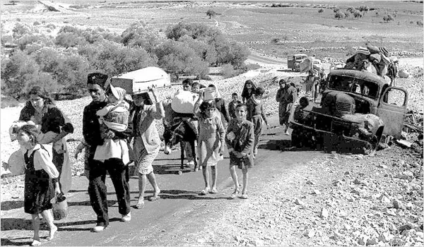 1948: Palestinian refugees making their way from Galilee..